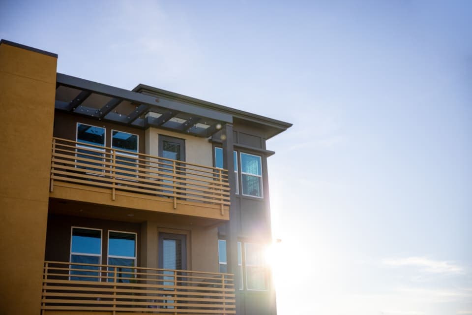 Timber-clad apartment building in sunlight